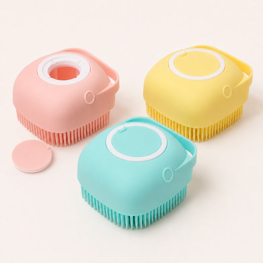 BubblePaw shampoo dispensing pet bath brushes in blue, pink and yellow with refill opening displayed