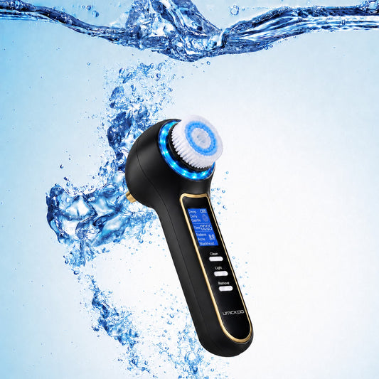 Black GlowPure electric facial cleansing brush with gold trim, LCD display and blue water splash