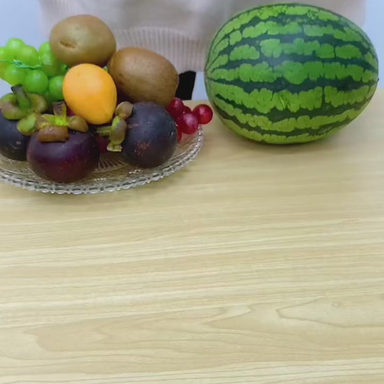 PeelSpin Dual colour hand-crank fruit peeler on a modern kitchen countertop