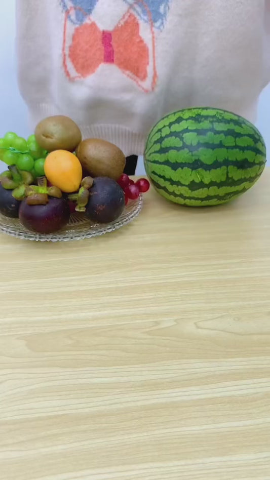 PeelSpin Dual colour hand-crank fruit peeler on a modern kitchen countertop
