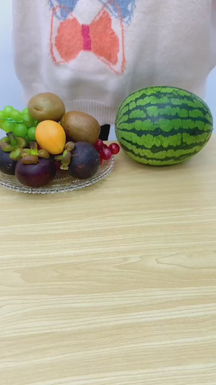 PeelSpin Dual colour hand-crank fruit peeler on a modern kitchen countertop