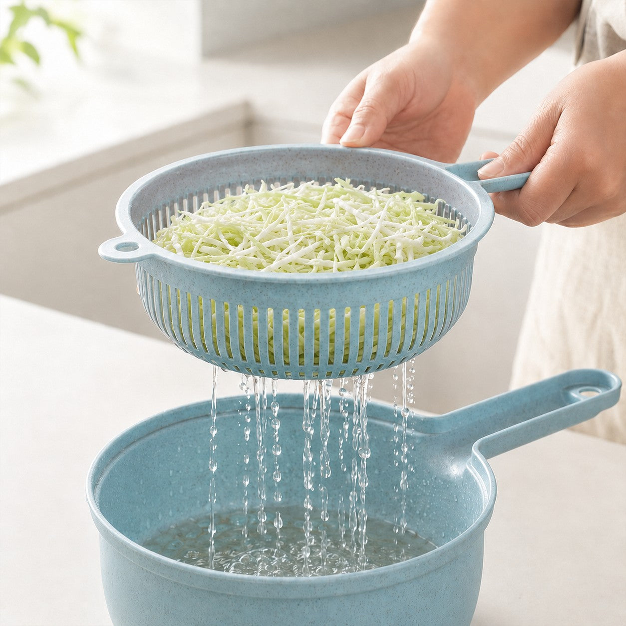 SliceMate blue vegetable slicer and strainer draining freshly shredded cabbage